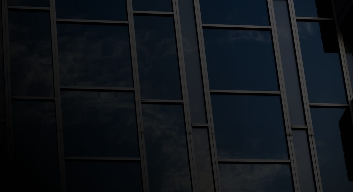 An office building with tinted flat glass windows
